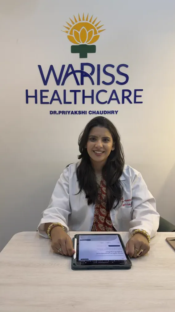 Dr. Priyakshi Chaudhry at her desk at Wariss Healthcare